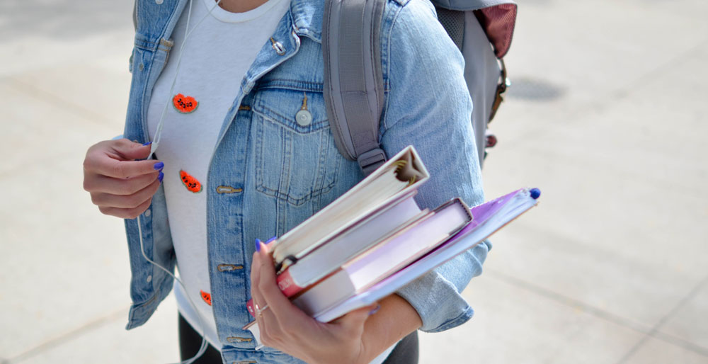 Student with a backpack to be put in a student elf storage facility