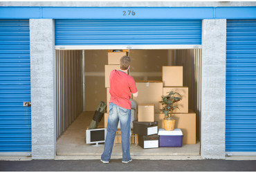 Man standing outside his self storage unit