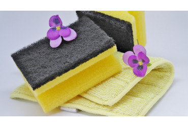 dish washing sponge on yellow towel